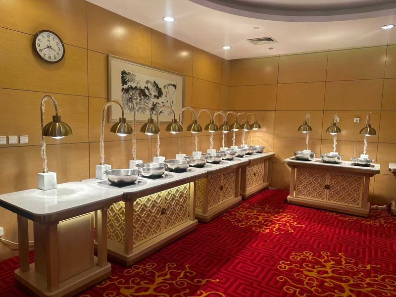Heat lamp serving station over a buffet counter